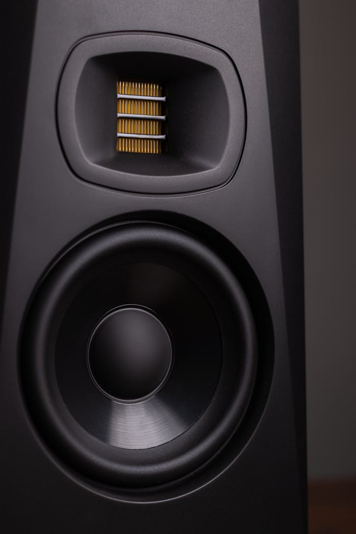 Detailed view of a high-end black loudspeaker showcasing its design and technology.
